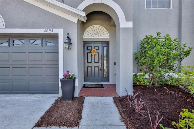 4094 Braemere Dr, Spring Hill, FL 34609 - entrance to property with stucco siding and a garage