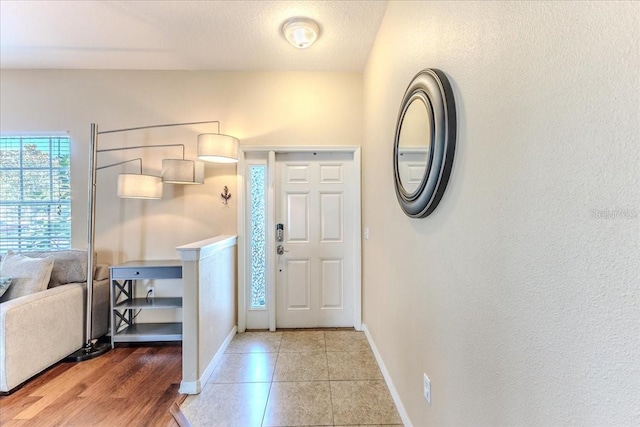 4094 Braemere Dr, Spring Hill, FL 34609 - entrance foyer featuring baseboards and light tile patterned floors