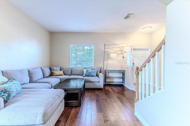 4094 Braemere Dr, Spring Hill, FL 34609 - living room featuring dark wood-type flooring, stairway, and baseboards