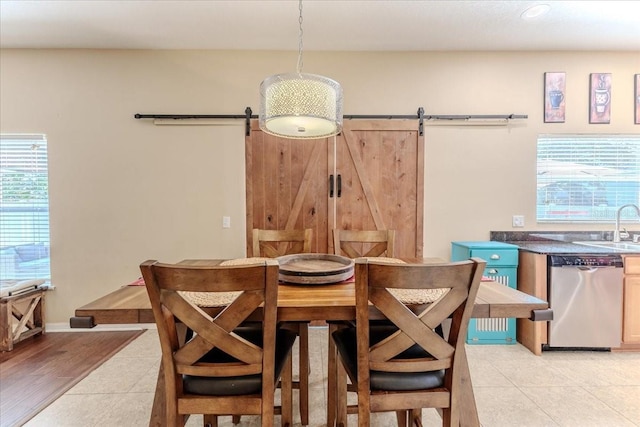 4094 Braemere Dr, Spring Hill, FL 34609 - dining area featuring a barn door, light tile patterned floors, and recessed lighting