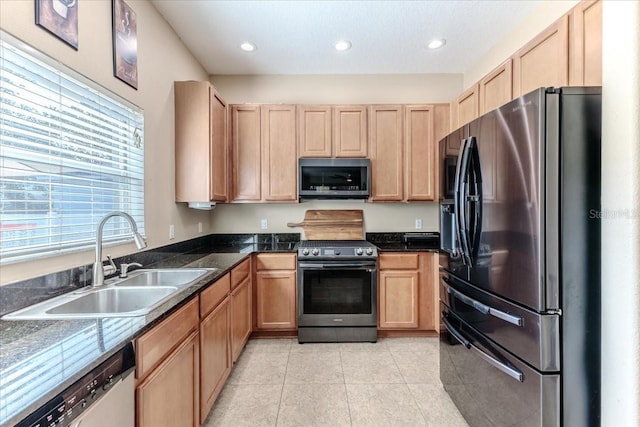 4094 Braemere Dr, Spring Hill, FL 34609 - kitchen with stainless steel appliances, a sink, light brown cabinets, light tile patterned flooring, and recessed lighting
