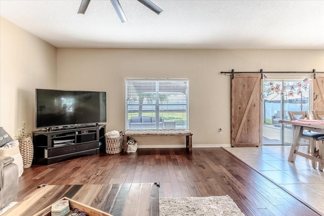 4094 Braemere Dr, Spring Hill, FL 34609 - living room featuring plenty of natural light, wood finished floors, baseboards, and ceiling fan