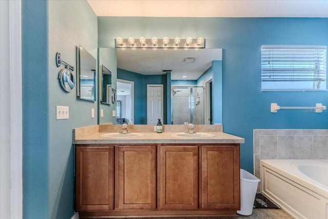 4094 Braemere Dr, Spring Hill, FL 34609 - full bathroom with a shower stall, a garden tub, and double vanity