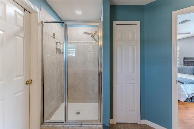 4094 Braemere Dr, Spring Hill, FL 34609 - full bath featuring connected bathroom, a closet, a stall shower, and baseboards
