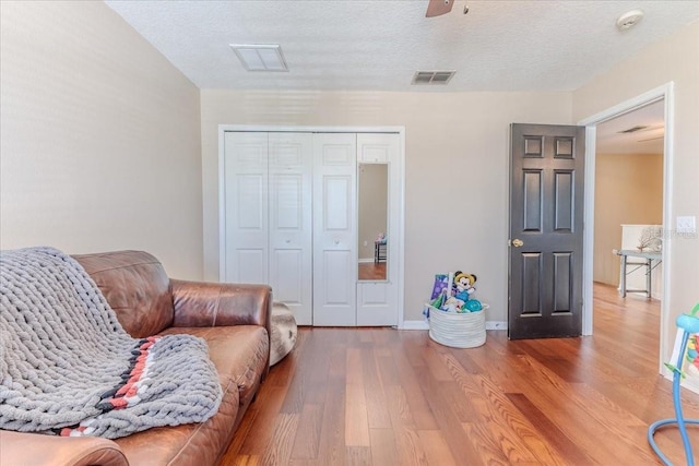 4094 Braemere Dr, Spring Hill, FL 34609 - living area featuring wood finished floors and a ceiling fan