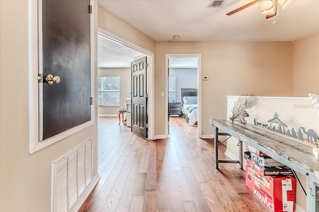 4094 Braemere Dr, Spring Hill, FL 34609 - corridor with light wood-style floors and baseboards