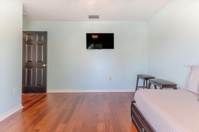 4094 Braemere Dr, Spring Hill, FL 34609 - bedroom with wood finished floors and baseboards