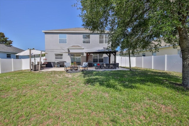4094 Braemere Dr, Spring Hill, FL 34609 - back of property with a gazebo, an outdoor living space with a fire pit, a patio area, and stucco siding