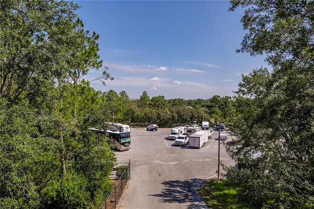 4094 Braemere Dr, Spring Hill, FL 34609 - uncovered parking lot with a forest view
