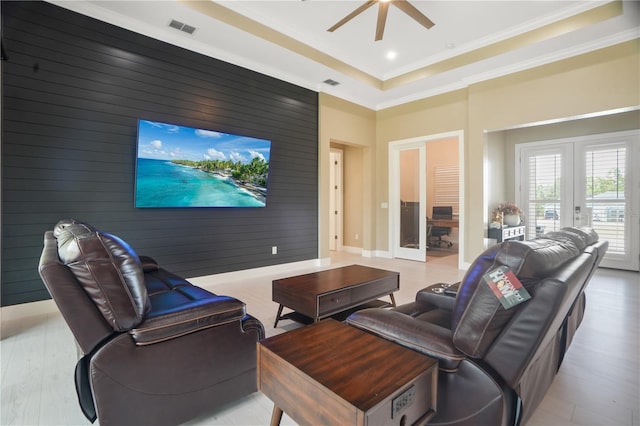 10380 Yellow Hammer Rd, Weeki Wachee, FL 34614 - living area featuring french doors, wood finished floors, a ceiling fan, ornamental molding, and wood walls
