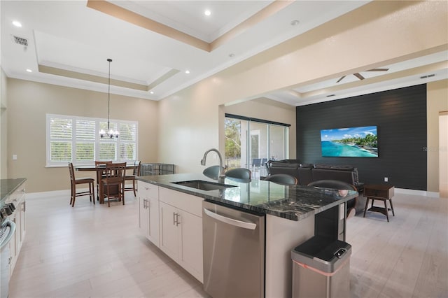 10380 Yellow Hammer Rd, Weeki Wachee, FL 34614 - kitchen featuring appliances with stainless steel finishes, a sink, a raised ceiling, white cabinetry, and baseboards