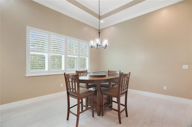10380 Yellow Hammer Rd, Weeki Wachee, FL 34614 - dining room featuring a chandelier, light wood finished floors, crown molding, baseboards, and recessed lighting