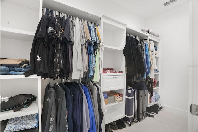 10380 Yellow Hammer Rd, Weeki Wachee, FL 34614 - walk in closet featuring wood finished floors