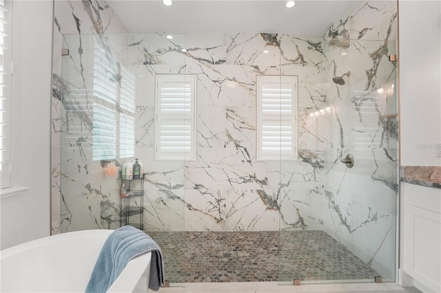 10380 Yellow Hammer Rd, Weeki Wachee, FL 34614 - full bathroom with a freestanding bath, a marble finish shower, and recessed lighting