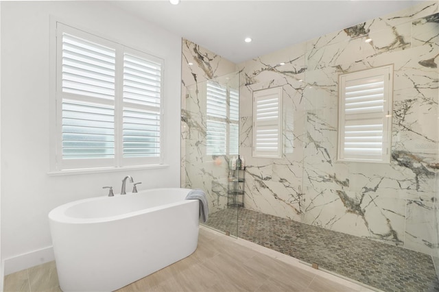 10380 Yellow Hammer Rd, Weeki Wachee, FL 34614 - full bathroom with a soaking tub, a marble finish shower, and recessed lighting