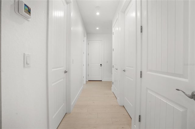 10380 Yellow Hammer Rd, Weeki Wachee, FL 34614 - corridor with light wood-type flooring, recessed lighting, and baseboards