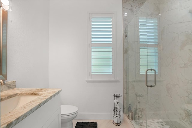 10380 Yellow Hammer Rd, Weeki Wachee, FL 34614 - full bathroom featuring vanity, a marble finish shower, toilet, and baseboards