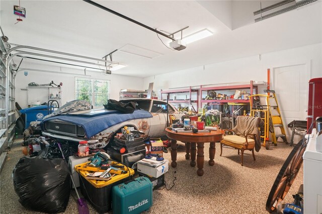10380 Yellow Hammer Rd, Weeki Wachee, FL 34614 - garage featuring a garage door opener