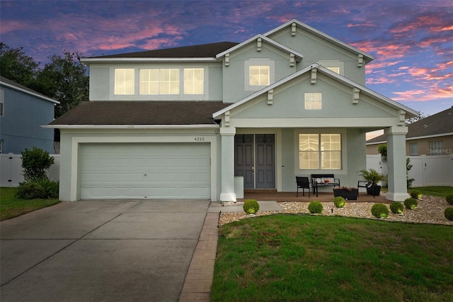 4215 Maplehurst Way, Spring Hill, FL 34609 - traditional-style home featuring stucco siding, an attached garage, concrete driveway, covered porch, and roof with shingles