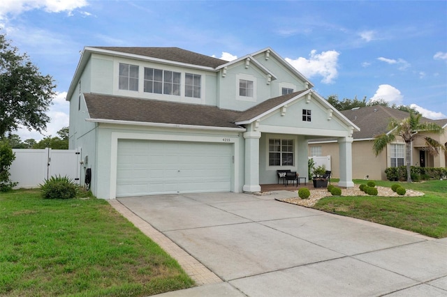 4215 Maplehurst Way, Spring Hill, FL 34609 - traditional-style house with stucco siding, a garage, and driveway