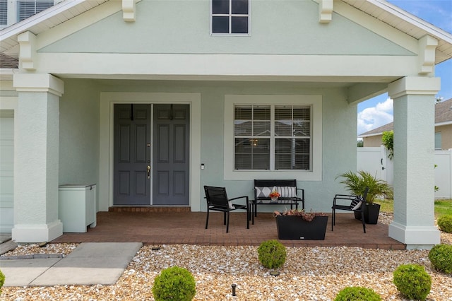 4215 Maplehurst Way, Spring Hill, FL 34609 - doorway to property featuring stucco siding and a porch