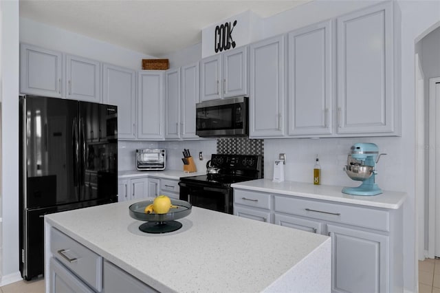 4215 Maplehurst Way, Spring Hill, FL 34609 - kitchen featuring black appliances, backsplash, a center island, and arched walkways