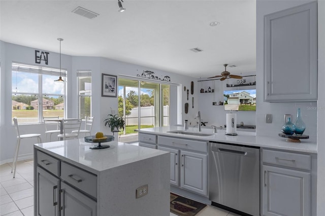 4215 Maplehurst Way, Spring Hill, FL 34609 - kitchen featuring dishwasher, a sink, a ceiling fan, a peninsula, and light tile patterned flooring