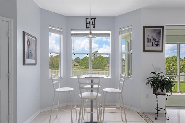 4215 Maplehurst Way, Spring Hill, FL 34609 - dining area featuring light tile patterned floors and baseboards