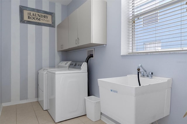 4215 Maplehurst Way, Spring Hill, FL 34609 - laundry room featuring independent washer and dryer, cabinet space, baseboards, light tile patterned floors, and wallpapered walls