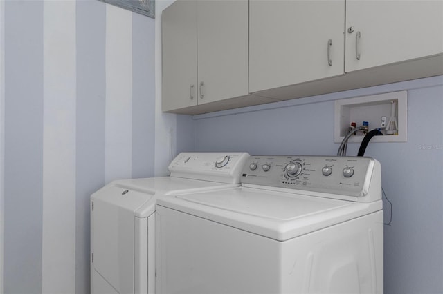 4215 Maplehurst Way, Spring Hill, FL 34609 - laundry room featuring cabinet space and washing machine and dryer