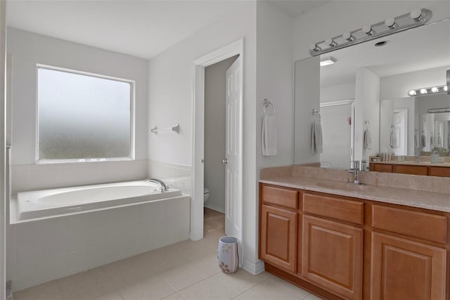 4215 Maplehurst Way, Spring Hill, FL 34609 - bathroom with vanity, a garden tub, toilet, tile patterned flooring, and a stall shower