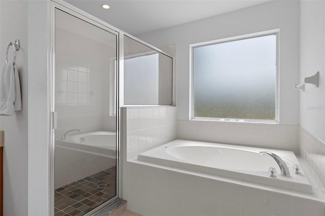 4215 Maplehurst Way, Spring Hill, FL 34609 - bathroom with a garden tub and a stall shower