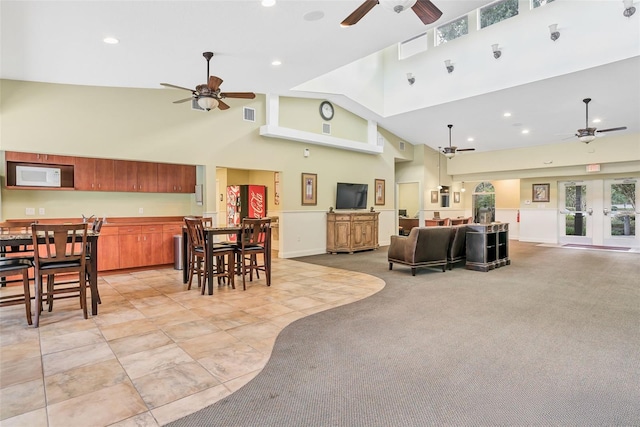 4215 Maplehurst Way, Spring Hill, FL 34609 - living room with a ceiling fan, a high ceiling, healthy amount of natural light, and recessed lighting