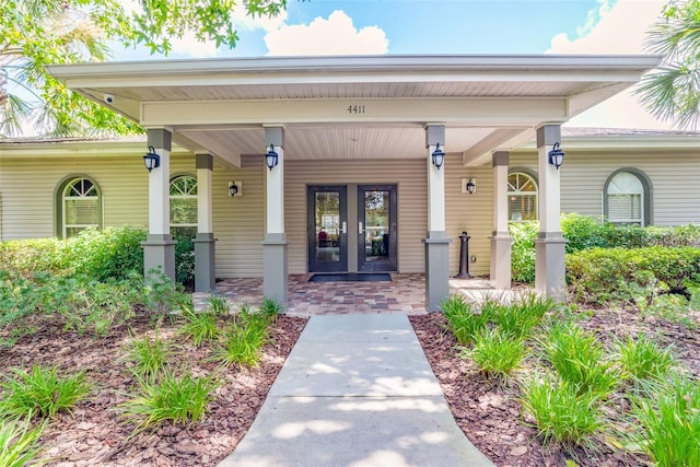 4215 Maplehurst Way, Spring Hill, FL 34609 - doorway to property featuring french doors and a porch