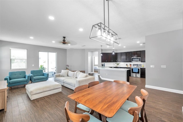 7523 Tangle Brook Blvd, Gibsonton, FL 33534 - dining area featuring recessed lighting, dark wood finished floors, baseboards, and a ceiling fan