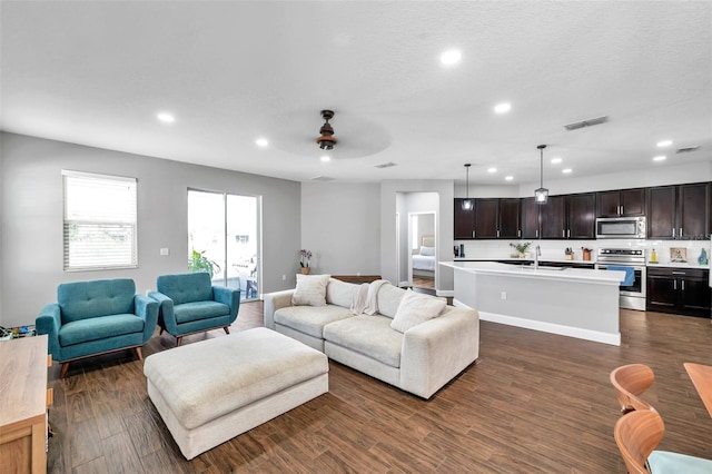 7523 Tangle Brook Blvd, Gibsonton, FL 33534 - living area featuring recessed lighting, a ceiling fan, and dark wood-style flooring