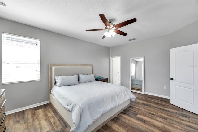 7523 Tangle Brook Blvd, Gibsonton, FL 33534 - bedroom featuring dark wood-style flooring, baseboards, and a ceiling fan