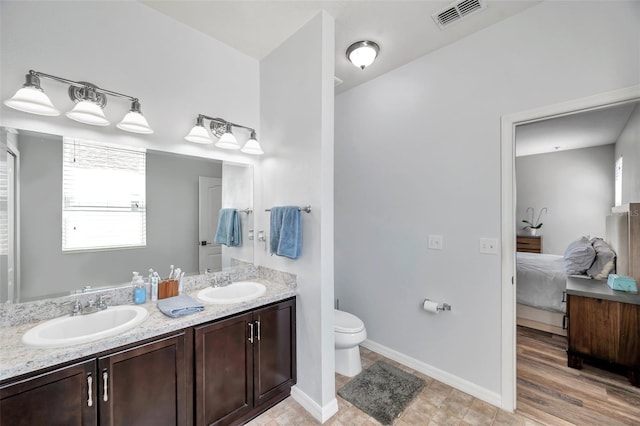 7523 Tangle Brook Blvd, Gibsonton, FL 33534 - full bathroom featuring ensuite bath, double vanity, toilet, and baseboards
