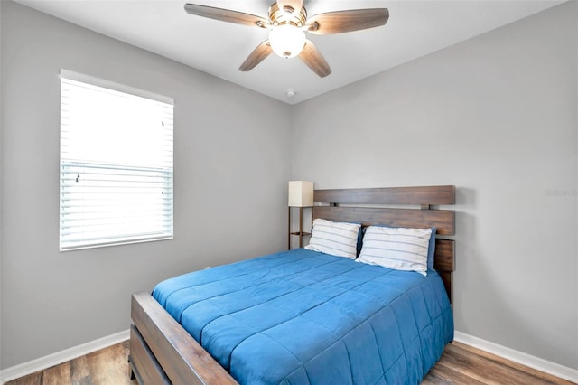 7523 Tangle Brook Blvd, Gibsonton, FL 33534 - bedroom featuring baseboards, wood finished floors, and a ceiling fan