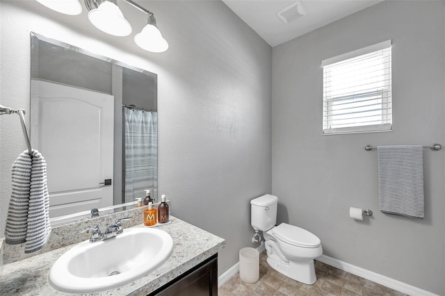 7523 Tangle Brook Blvd, Gibsonton, FL 33534 - bathroom featuring baseboards, vanity, and toilet