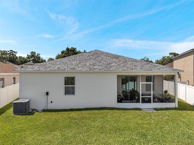 7523 Tangle Brook Blvd, Gibsonton, FL 33534 - rear view of house with cooling unit, a shingled roof, a sunroom, and stucco siding