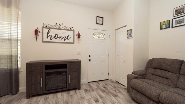 12458 Fish Cove Dr, Spring Hill, FL 34609 - entrance foyer with light wood finished floors and baseboards