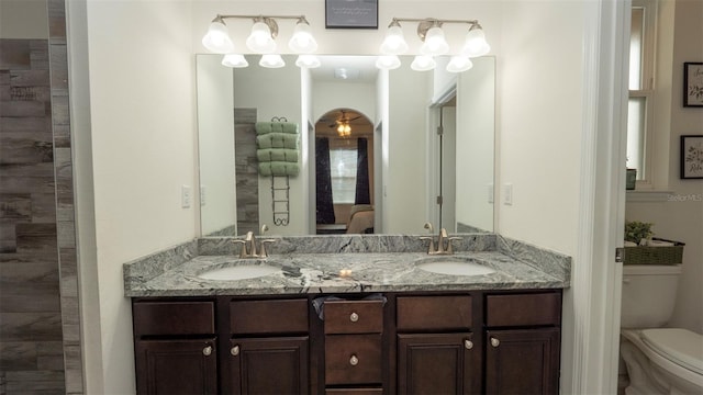 12458 Fish Cove Dr, Spring Hill, FL 34609 - bathroom featuring toilet and double vanity