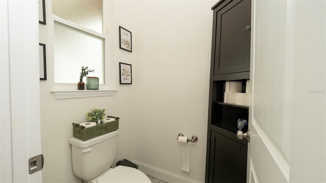 12458 Fish Cove Dr, Spring Hill, FL 34609 - bathroom with toilet and baseboards