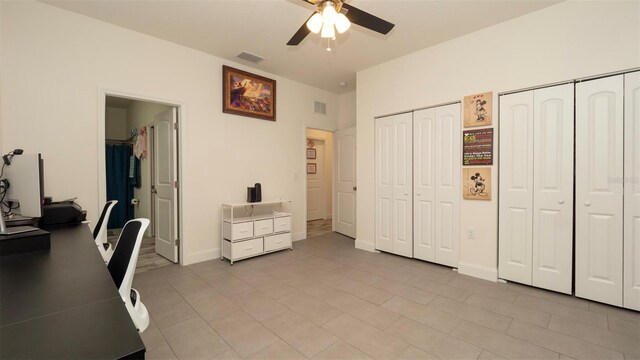 12458 Fish Cove Dr, Spring Hill, FL 34609 - office featuring a ceiling fan, light tile patterned floors, and baseboards