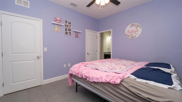 12458 Fish Cove Dr, Spring Hill, FL 34609 - bedroom featuring tile patterned floors, baseboards, and a ceiling fan