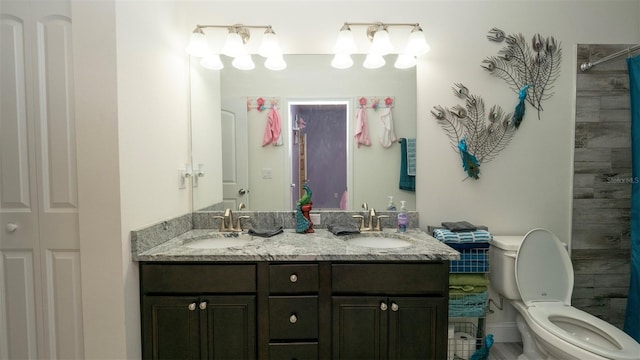 12458 Fish Cove Dr, Spring Hill, FL 34609 - full bathroom featuring toilet, double vanity, and a shower