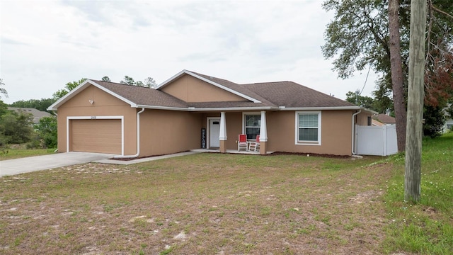 12458 Fish Cove Dr, Spring Hill, FL 34609 - ranch-style house featuring an attached garage, stucco siding, driveway, and covered porch