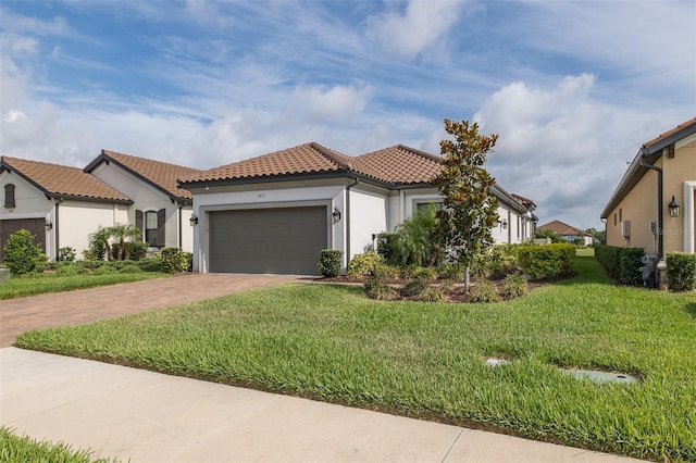 3051 Francoa Dr, Odessa, FL 33556 - mediterranean / spanish home featuring decorative driveway, a garage, stucco siding, and a front yard