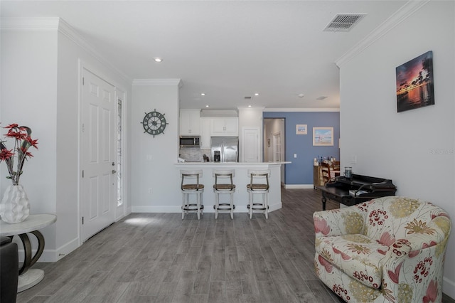 3051 Francoa Dr, Odessa, FL 33556 - living room featuring wood finished floors, recessed lighting, baseboards, and crown molding